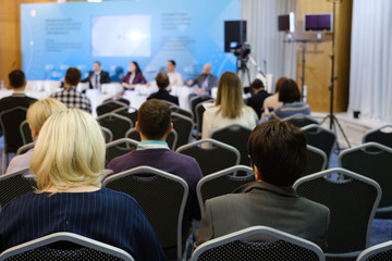 Audience listens to the lecturer at the conference