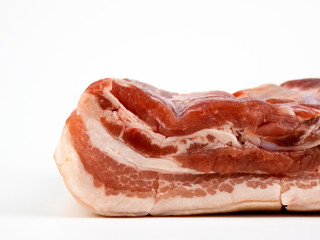 raw pork belly isolated on white copyspace closeup