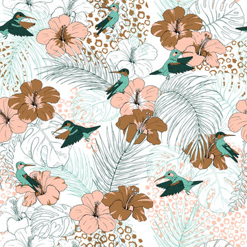 Hummingbird and tropical leaves and flowers