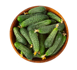 cucumbers in a bowl isolated on white