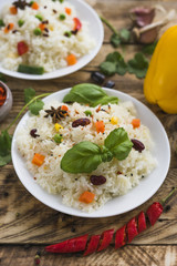 Ready to eat delicious food with fresh vegetables on wooden plank