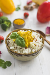 Close-up of healthy rice; basil leaves and chicken in bowl