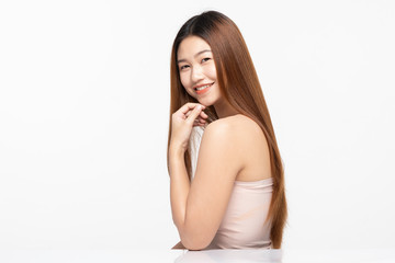 Naklejka premium Side View Of Beautiful Young Asian Woman Looking Away While Touching Chin feeling so happy and cheerful with healthy Clean and Fresh skin,isolated on white background,Beauty Cosmetology Concept