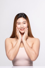 Fototapeta premium Beautiful Attractive Charming Asian young woman smile with white teeth and touching soft cheek feeling so happy and cheerful with healthy skin,isolated on white background,Beauty Cosmetology Concept