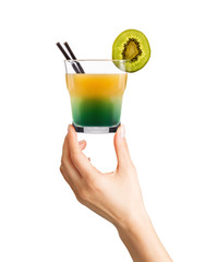 Woman hand holding cocktail glass with ice cubes on white background.