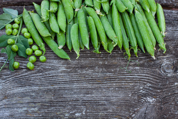 fresh pea on dark wooden surface