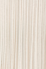 Obraz premium Close up of cotton macrame panel yarn in a minimalistic scandinavian wall. Texture. Background.