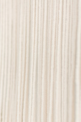 Close up of cotton macrame panel yarn in a minimalistic scandinavian wall. Texture. Background.