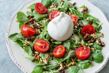 Burrata Cheese with Purslane Salad, Cherry Tomatoes, Pine Nuts and Roasted Walnuts.