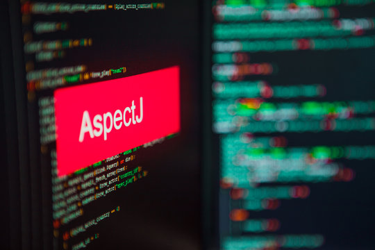 Programming language, AspectJ inscription on the background of computer code.
