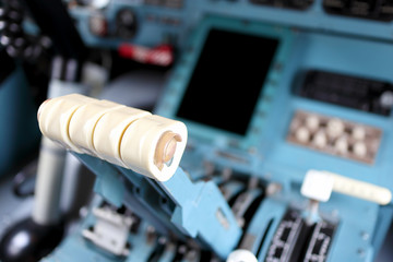 engine control levers in the cockpit close-up with blurred background