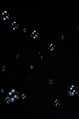 Soap bubbles on black background