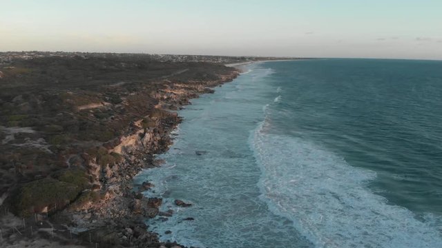 Aerial View of Colourful deep blue waves crashing along the Beach in Perth Australia