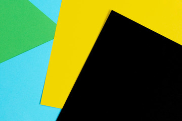 Abstract geometric shape light blue, green, yellow and black color paper background