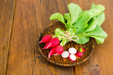 Fresh farmer bio radish on wooden plate. 
