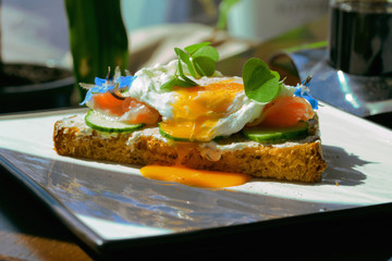 Smorrebrod, Danish Open Sandwich with Smoked Salmon, square with poached egg