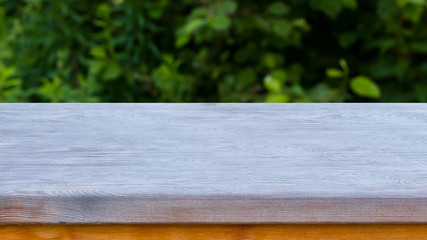 Wooden texture background with blurred nature background
