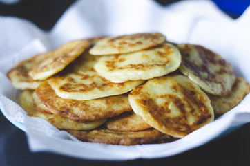 Pancakes with zucchini vegetable and sour cream.