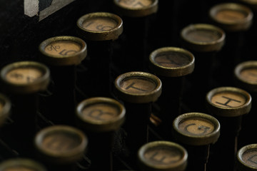 A Close-up image of a vintage typewriter Round-Key Keyboard.