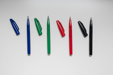 Image of blue, red, green and black four color pens