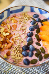 Healthy breakfast. Oatmeal porridge with fresh fruit and cranberries.