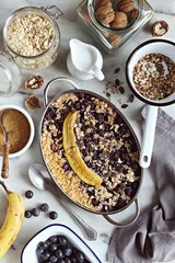 Super seedy vegan baked oatmeal with blueberries and caramelized banana. 