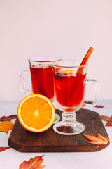  Hot red mulled wine with orange slice, anise and cinnamon sticks. 