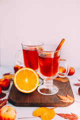  Hot red mulled wine with orange slice, anise and cinnamon sticks. 