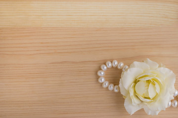 white rose on a wooden background