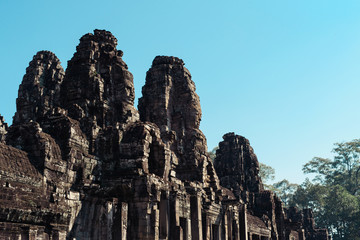 Faces of Bayon temple in Angkor Thom, Siemreap, Cambodia. The Prasat Bayon is a richly decorated...