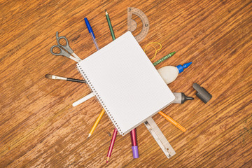Stationery around notebook