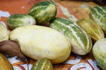 Overgrown cucumber in the Asian market. Vegetarian theme. Stock photo