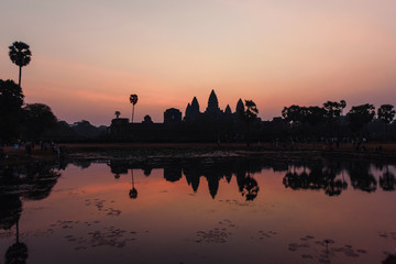 Fototapeta na wymiar Sunrise in Cambodia. Angkor Wat is the largest religious monument in the world and a World heritage listed complex