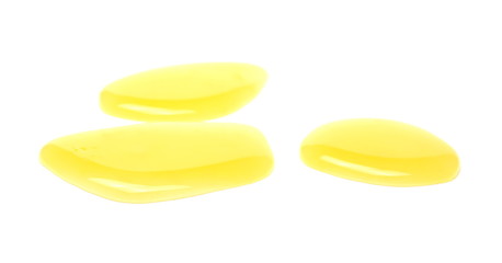 Orange juice spilled puddle, isolated on white background