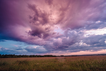 Fototapeta na wymiar A dramatic storm clouds at sunset