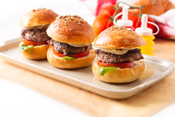 Food concept Homemade beefs hamburgers serve on square plate on white background with copy space
