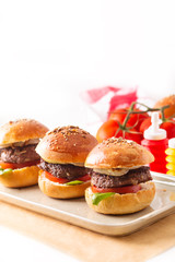 Food concept Homemade beefs hamburgers serve on square plate on white background with copy space