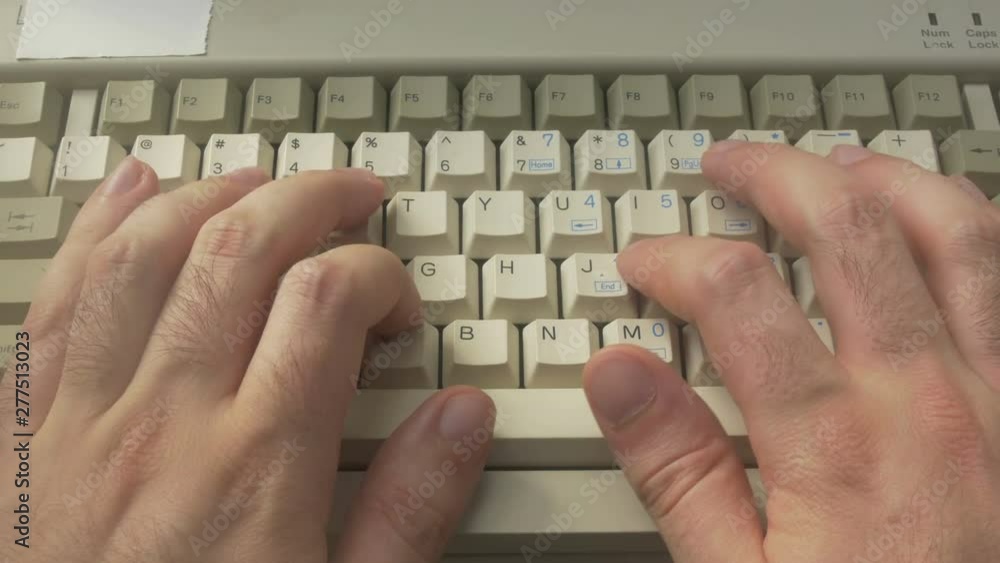 Wall mural typing on an old retro computer keyboard