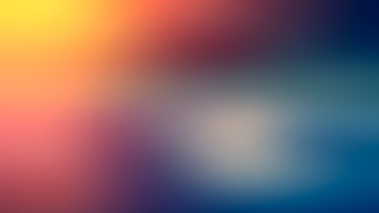 Red, yellow, blue and white gradient abstract blurred background of red, yellow, blue and white spots.