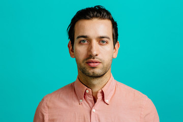 Studio portrait of serious young man