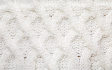 Fototapeta na wymiar White cable knitting fabric textured background