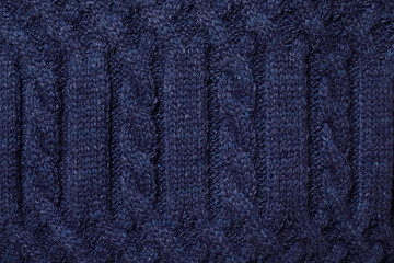 Fototapeta premium Blue cable knitting fabric textured background
