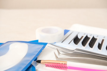 Eyelash Extension Procedure background. tools. glue, tweezers, brushes. Copyspace for text - Beauty salon, fashion and woman make up concept