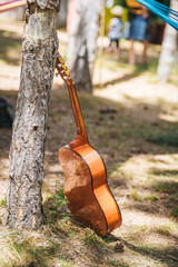 Acoustic guitar in the forest during an outdoor art festival