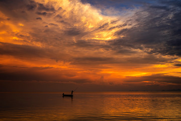 Naklejka na ściany i meble Minimal silhouette fisherman on the lake with twilight sky.