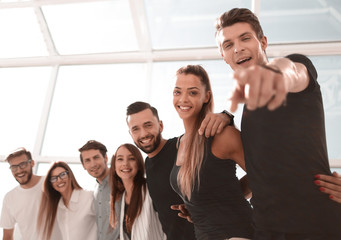 happy business team standing in bright office.