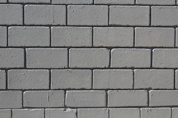 A wall made of grey bricks - background