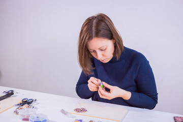 Designer making handmade brooch