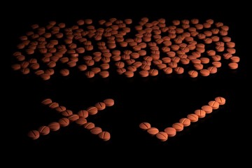 Orange colour round pills on black background with selective focus. Pills that look like ecstasy.