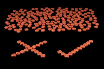 Orange colour round pills on black background with selective focus. Pills that look like ecstasy.